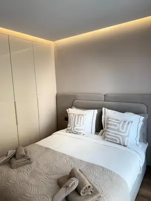 a bedroom with a large bed with white pillows at Appartement moderne en plein Gueliz in Marrakech