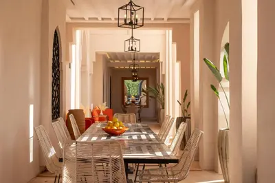 a dining room with a table and chairs at Villa Montbel in Marrakech