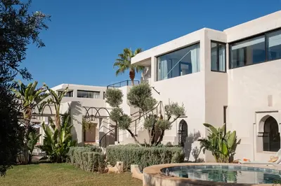 an image of a house with a swimming pool at Villa Montbel in Marrakech