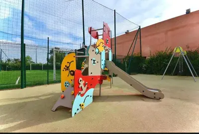 a playground with a slide at a playground at Marrakech Peaceful Escape - Appartement Noria Marrakech in Marrakech