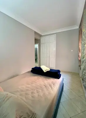 a bedroom with a large bed in a room at Appartement allal el fassi in Marrakech