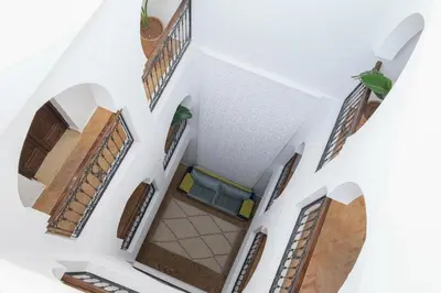 an overhead view of a house with doors and floors at Riad Armonia in Marrakech
