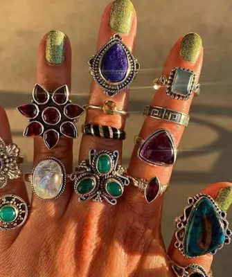 a hand with a bunch of bracelets andjewelries at Dar Hiba in Marrakech