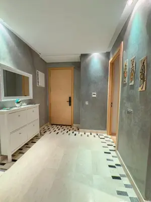 a room with a bathroom with a sink and a door at VIVASTAY Marrakech - Prestigia Topaze- Terrace overlooking garden & pool in Marrakech