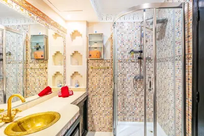 a bathroom with a sink and a shower at Nid Andalou balcony and calm in Oulad Akkou