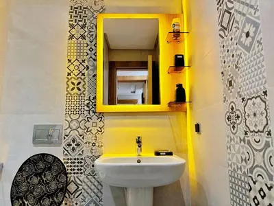 a bathroom with a sink and a mirror at Appartement Marrakech-GOLDEN OASIS in Marrakech