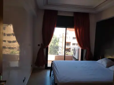 a bedroom with a bed and a large window at Babylon 1