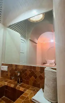 a bathroom with a sink and a mirror at Riad Keke 4 suites - Pool&Rooftop - Bahia in Marrakech