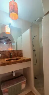 a bathroom with a sink and a shower with a mirror at Riad Keke 4 suites - Pool&Rooftop - Bahia in Marrakech