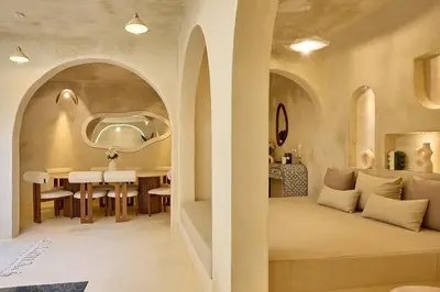 a living room with a table and a dining room at Luxury Private Riad - Pool - Breakfast Included in Marrakech