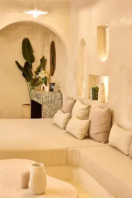 a living room with a large bed in a room at Luxury Private Riad - Pool - Breakfast Included in Marrakech