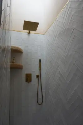 a bathroom with a shower with a shower head at Little date in Marrakech