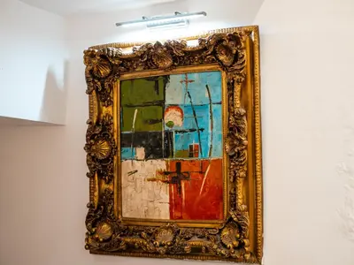a picture of a painting hanging on a wall at Riad Jebly - Exclusive -Jacuzzi & Breakfast ,10 min walk Jemaa El Fnaa - Panoramic View Rooftop in Marrakech