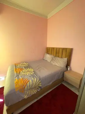a bedroom with a bed in a room at Abwab guiliz in Marrakech