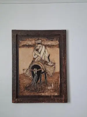 a painting of a man riding a horse at Appartement a louer 2 chambres in Marrakech