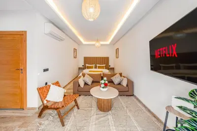 a living room with a couch and a table at Guéliz 7 Appartements in One Building in Marrakech