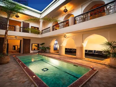 an indoor swimming pool in a house with a building at Riad Darhani - Private use option - in Marrakech
