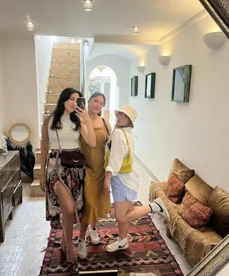 a group of three women standing in a living room at Riad Beata - Private use option - in Marrakech