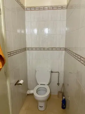 a small bathroom with a white toilet in it at Modern Flat Gueliz ,City center Marrakech in Marrakech