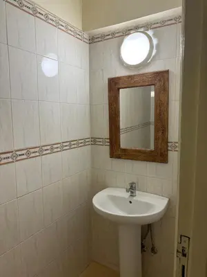 a bathroom with a sink and a mirror at Modern Flat Gueliz ,City center Marrakech in Marrakech