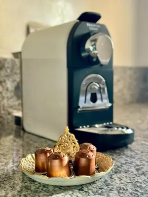 a plate of donuts on a counter next to a toaster at Luxury Apartments in Marrakech