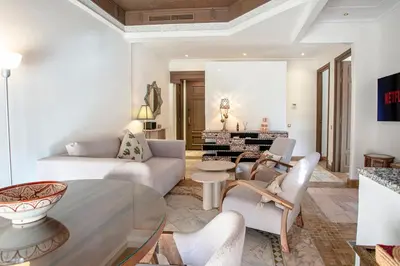 a living room with a couch and a table at Marrakech Palmeraie 3, 2-bedroom appartement, ,res with pool in Marrakech