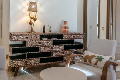 a piano in a room with a chair and a lamp at Marrakech Palmeraie 3, 2-bedroom appartement, ,res with pool in Marrakech