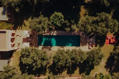 an overhead view of a swimming pool in a yard with trees at Casa Memoria Marrakech in Marrakech