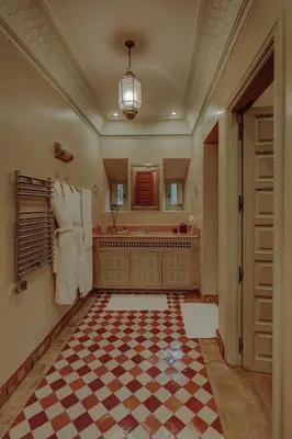 a bathroom with a checkered floor and a sink at Casa Memoria Marrakech in Marrakech