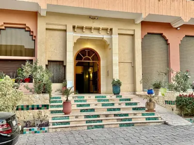 a building with steps leading up to a door at Moroccan style Soltana pool & central internet in Marrakech