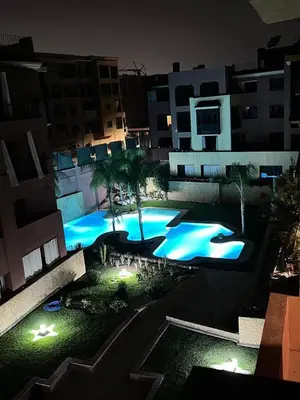an overhead view of a swimming pool at night at Moroccan style Soltana pool & central internet in Marrakech