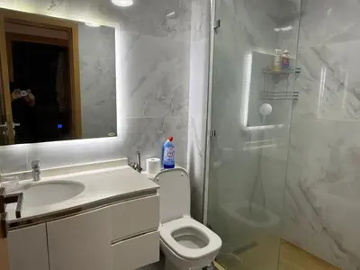 a bathroom with a shower and a toilet and a sink at Moderne spacieux cosy in Marrakech