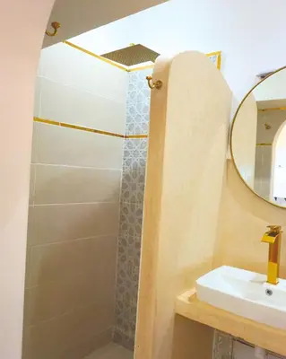 a bathroom with a shower and a sink at Little date in Marrakech