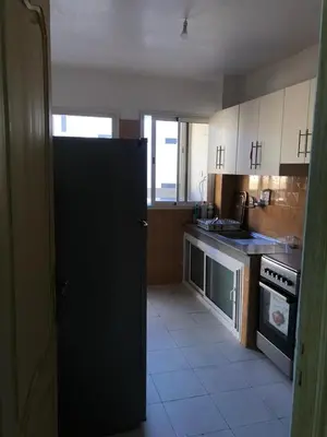 a kitchen with a black door in a kitchen at Majorelle louza in Marrakech