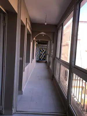 a hallway in a building with windows and a hallway with a hallwayngthngthngth at Majorelle louza in Marrakech