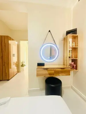 a mirror hanging on a wall in a room at TheCosyCorner in Marrakech