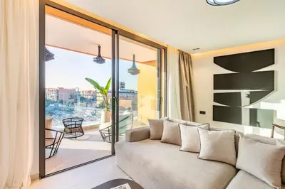 a living room with a couch and a balcony at New apartment, quiet and well located with balcony in Marrakech