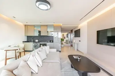 a living room with a couch and a table at New apartment, quiet and well located with balcony in Marrakech