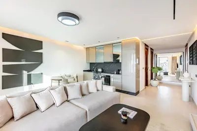 a living room with a couch and a table at New apartment, quiet and well located with balcony in Marrakech