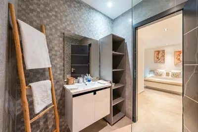 a bathroom with a sink and a shower at Modern Golf Retreat Heated Pool & Free breakfast in Marrakech