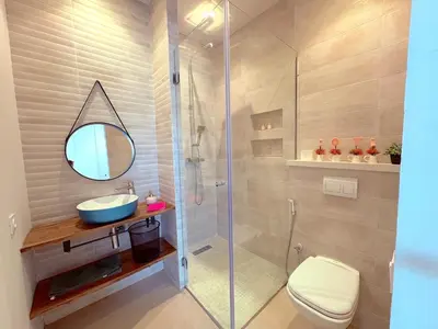 a bathroom with a shower and a toilet and a sink at Palais Naya in Marrakech