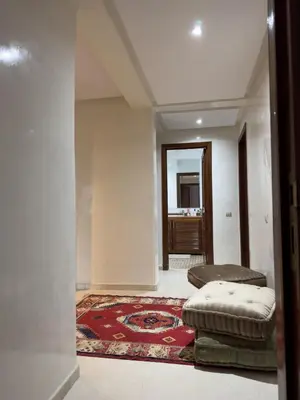 a living room with a couch and a rug at Luxury 2 bedroom apartment - Gueliz Plaza in Marrakech