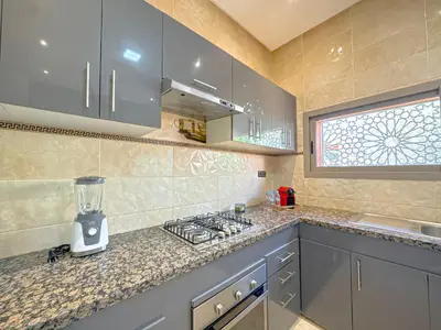 a kitchen with a counter with a blender on it at Villa Andalus - Piscine privée & Suite Parentale in Marrakech