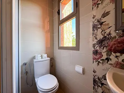 a bathroom with a toilet and a sink at Villa Andalus - Piscine privée & Suite Parentale in Marrakech