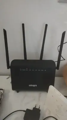 a black router sitting on top of a table at Cocon chaleureux proche commerces et centre in Marrakech