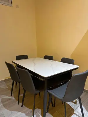 a conference room with a white table and chairs at Studio tranquille dans le village touristique in Marrakech