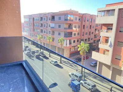 a view of a parking lot from a building at Chic garden & grand balcon in Marrakech
