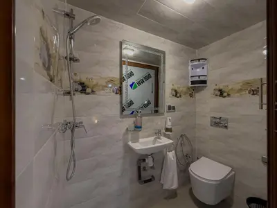 a bathroom with a sink and a shower and a toilet at Essalmi Duplex Apartment in Marrakech in Marrakech