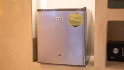 a refrigerator with a apple on the side of it at Riad Le Soleil Rouge in Marrakech