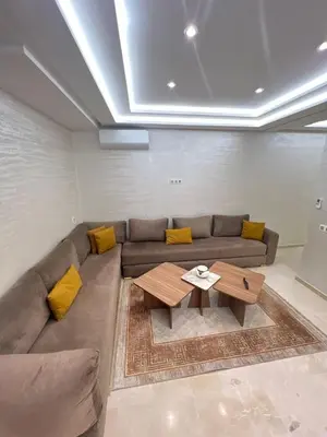 a living room with a couch and a coffee table at Des appartements conçus pour votre confort in Marrakech